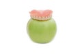 Dentures with green apple Royalty Free Stock Photo