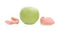 Dentures with green apple Royalty Free Stock Photo