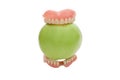 Dentures with green apple, isolated Royalty Free Stock Photo