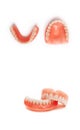 Dentures on a white background. Acrylic denture on white background. Full denture close-up.