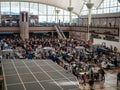 Travelers standing in long queue at TSA security checkpoint at Denver International Airport