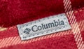 Columbia brand label close-up on a red cotton shirt
