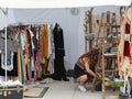 A vendor arranges items in a booth at the Spring Bazaar in RINO Art District. Royalty Free Stock Photo