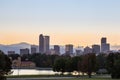 Denver downtown skyline and rocky mountain at sunset.