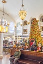 People relax and wait for train inside of historic Union Station in Denver, Colorado