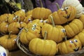 Deocrative face pained pumpkins on display at shop