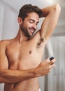 Deodorant, clean spray and man in bathroom for hygiene, shower and perfume to control underarm sweating. Happy shirtless Royalty Free Stock Photo