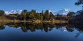 Reflection of 300 degree range of mountain and sky in the calm water of Deorital lake.nd. Royalty Free Stock Photo