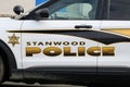 Department name on side of Stanwood Police car with shield