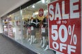 Large sale sign in a shop`s window. Royalty Free Stock Photo