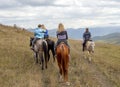 Departure on horseback, foggy cloudy mountain landscape