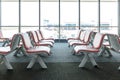 Departure lounge with empty chairs in the terminal of airport Royalty Free Stock Photo
