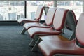 Departure lounge with empty chairs in the terminal of airport Royalty Free Stock Photo