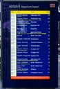 Departure schedule board in Frankfurt train station with status and rail number of departing trains Royalty Free Stock Photo