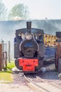 Departure of a steam locomotive in a cloud of smoke and steam in