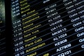 Departures flight information schedule in international airport Royalty Free Stock Photo