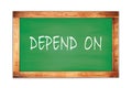 DEPEND ON text written on green school board