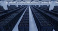 Data Center Server Room with Rows of Rack Cabinets under Blue Lighting in Telecommunications Facility for Cloud Royalty Free Stock Photo