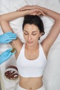 Depilation and epilation female armpit with liquid sugar paste. Royalty Free Stock Photo