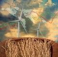 Deplorable concept, Rice paddy in wooden tray with wind turbine and growth charts Royalty Free Stock Photo