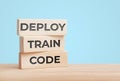 Deploy train code ai technology concept with wooden blocks Royalty Free Stock Photo
