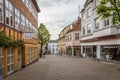 A depopulated pedestrian street with old houses and shops in danish town Svendborg