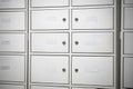 Deposit boxes at the post office for incoming mail.