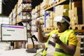 Depot clerk uses virtual reality headset to manage order processing Royalty Free Stock Photo
