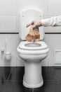 Depreciation of the currency the Russian ruble - a person throws money into the toilet. Loss of value , inflation and low exchange