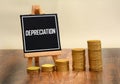 Depreciation Sign with currency gold coins stack