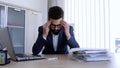 Depresed man having a headache from work problems