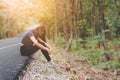 Depress and hopeless , Asian woman sitting on roadside