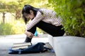 Depressed asian child girl student failed important test,female student sit hugs her knees up to the chest and crying alone,sad Royalty Free Stock Photo