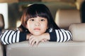 Depressed Asian chinese child. Little girl showing her unhappy face in car Royalty Free Stock Photo