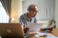 Depressed Asian Senior Elderly male feel worry about financial problem. Stressed desperate older man looking frustrated to Royalty Free Stock Photo