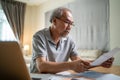 Depressed Asian Senior male feeling worried about financial problem. Stressed desperate elderly older man looking frustrated to Royalty Free Stock Photo