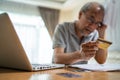 Depressed Asian Senior male feeling worried about financial problem. Stressed desperate elderly older man looking frustrated to Royalty Free Stock Photo