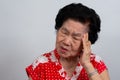 Depressed Asian senior woman lonely disappointed and lose memory in isolated white background. Portrait old woman ill sick Royalty Free Stock Photo