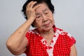 Depressed Asian senior woman lonely disappointed and lose memory in isolated white background. Portrait old woman ill sick Royalty Free Stock Photo