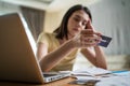 Depressed Asian young girl feel worry about financial problem in house. Stressed desperate young woman looking frustrated to Royalty Free Stock Photo