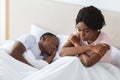 Depressed black woman dont sleep while her boyfriend sleeping