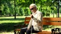 Depressed blind man sitting alone in park, socially disadvantaged population Royalty Free Stock Photo