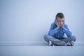 Depressed boy with Asperger syndrome Royalty Free Stock Photo