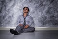 Depressed businessman sitting on the floor Royalty Free Stock Photo