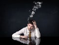 Depressed businessman with smoking head Royalty Free Stock Photo