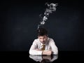 Depressed businessman with smoking head Royalty Free Stock Photo