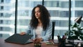 Depressed businesswoman opening laptop starting work in company office close up. Royalty Free Stock Photo