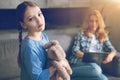 Depressed child waiting for mom to pay attention to her Royalty Free Stock Photo