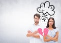 Depressed couple holding broken heart Royalty Free Stock Photo