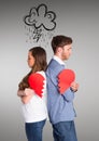 Depressed couple holding broken heart Royalty Free Stock Photo